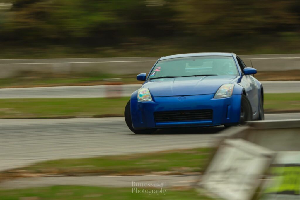 blue 350z drifting sideways